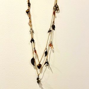 Waxed cord necklace with hand-tied charms of copper, brass & crystal.